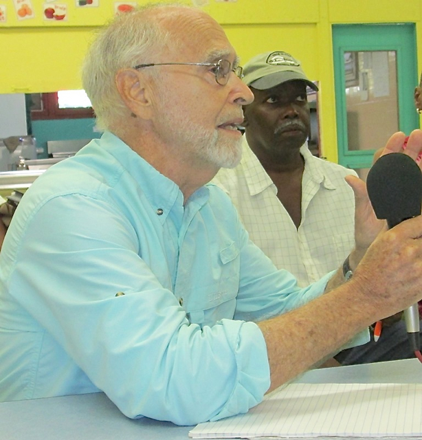 Glen Speer, left, and Gabriel Nathaniel discuss the impact of property taxes.