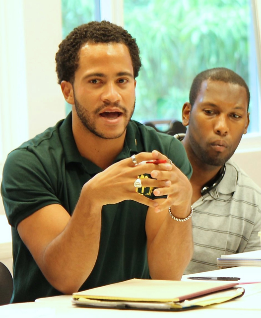 Sunrise Leadership founder Griffin McFarlane, left, warns against treating youth as a homogenous group. Jamaal Carroll, head of UVI's Anti-Violence Initiative, listens in the background.