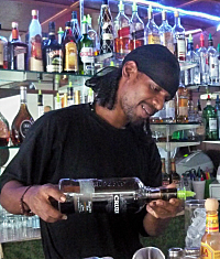 Dwayne Tobal whips up a rum drink at the bar.