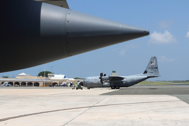 Four WC-130J aircraft sit on the tarmac at the Henry E. Rohlsen Airport on St. Croix, where the Hurricane Hunters have their forward operating base.