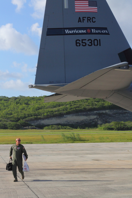 Lt. Col. Kevin McLuen walks behind his plane after a successful mission.