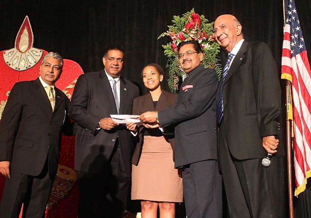 From left, India Association Vice President Pash Daswani, Gov. John deJongh, UVI official Dionne Jackson, India Consul General Ajit Kumar, and association President Mulo Alwani with a scholarship donation.