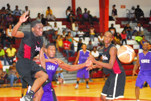 Boys Dem Saleem Ross, left, and Amadeus Derweer battle Kings Cuthbert Victor for a loose ball in the frantic fourth period.