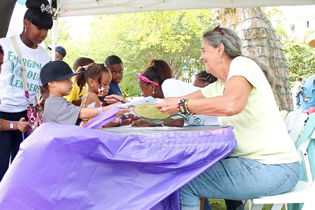 Author Christina Kessler, right, signs copies of her book, 'Hope is Here,' for her young fans.