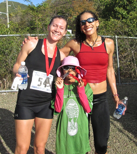 Women's winner Ruth Ann David, right, her daughter Shaiah David, and second place women's finisher Devon Nemire-Pepe celebrate at the end of a tough race..