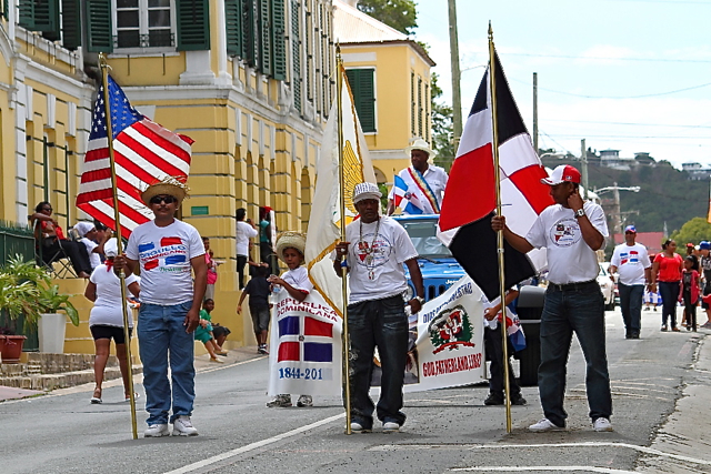 The Dominican, Virgin Islands and United States flags parade through town side by side in a show of unity.