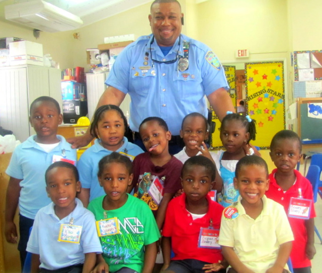 School Resource Officer Roy Chesterfield gathers with nine youngsters from the Tutu Head Start program. (V.I. Police Department photo) 