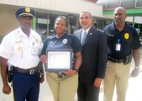 DLCA Lt. Diane Gumbs-Santos, second from left, received a commendation Thursday for her quick action that led to three arrests after a Festival shooting on Jan. 1.