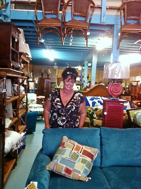 Elizabeth Hall displays an array of the furniture she sells at Island Empire.