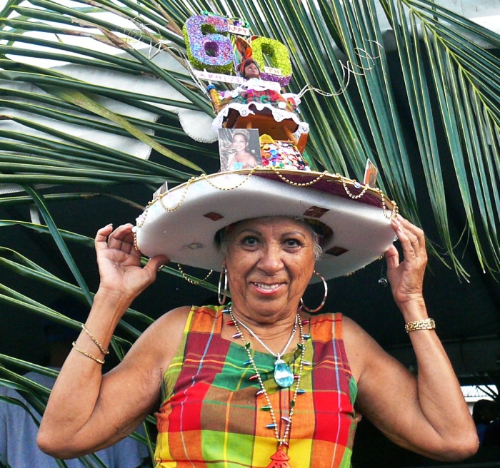 Gloria Gordon shows off her newest Three Kings Day – Cruzan-Rican Breakfast hat (Bill Kossler photo).