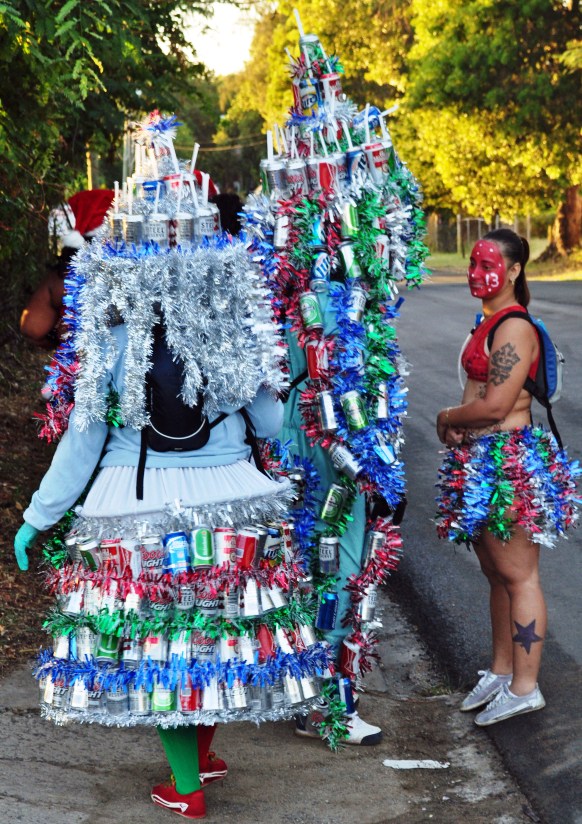 Sister and brother Jackie and Johnny Hughes model their J’ouvert costumes made from beer cans, string and Christmas tinsel. 