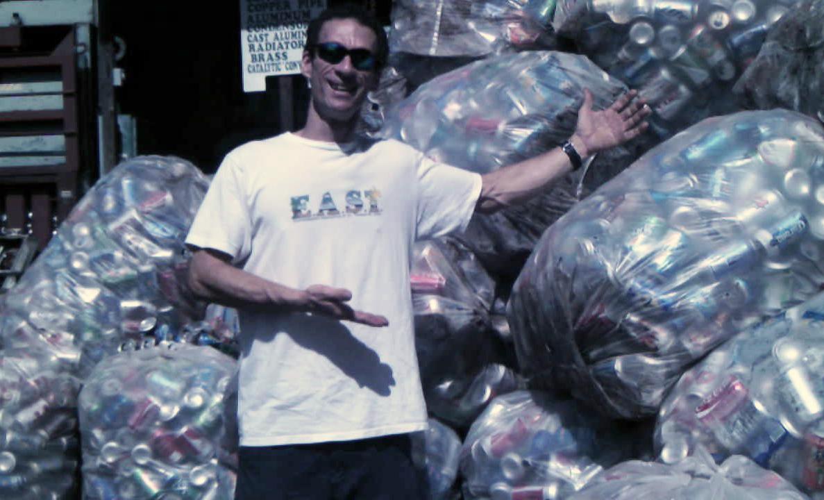 Jason Budson stands in front of a day&rsquo;s worth of collected aluminum cans at Magens Bay.