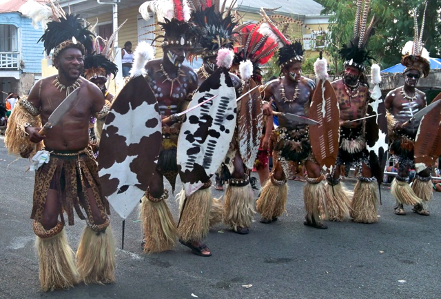 The Shaka Zulu Troupe of St. Thomas marches through Frederiksted. (Carol Buchanan photo)