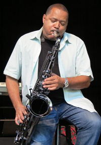 Najee warms up on the tenor saxophone.