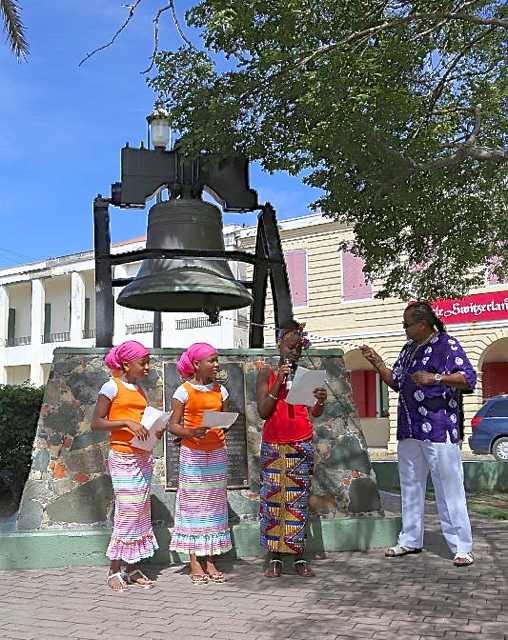 A bell-ringing ceremony begins the ceremony by paying tribute to Virgin Islands ancestors.