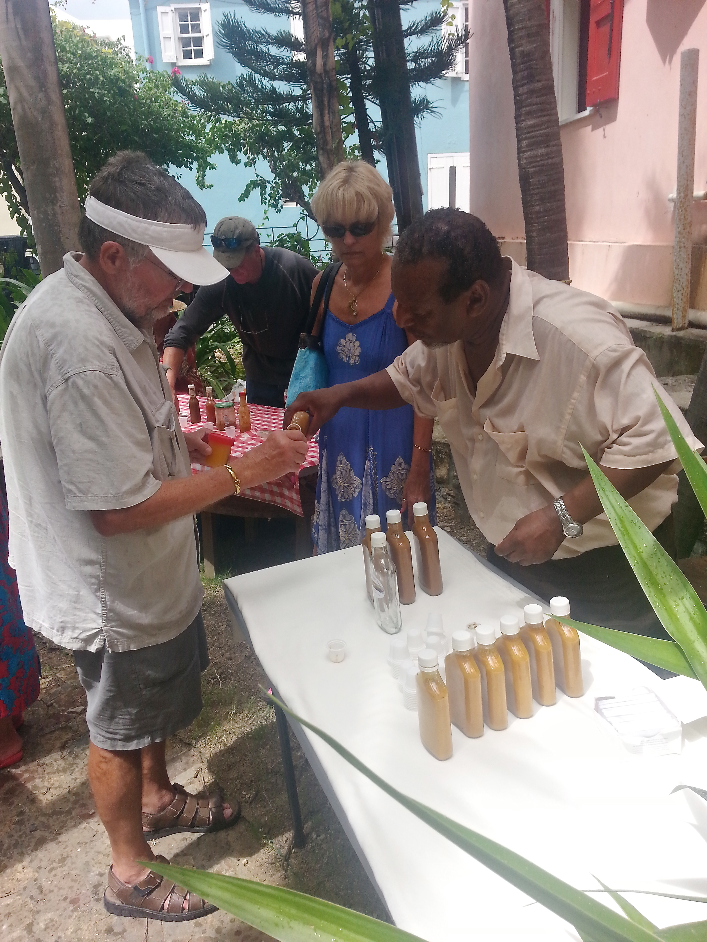 James Gibbs offers a sample Saturday at the Krewe de Croix hot sauce competition.
