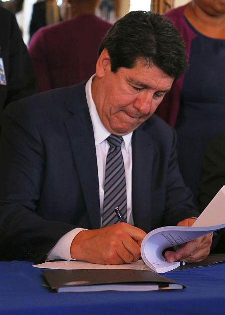 Mike Loya, president of Vitol for America, seals the deal with WAPA.