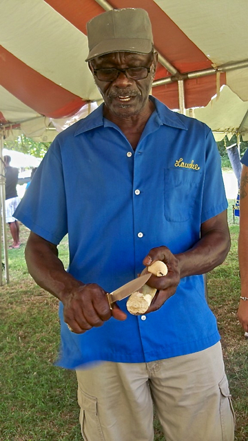 Rotarian Lauchland Tonge carves a top.