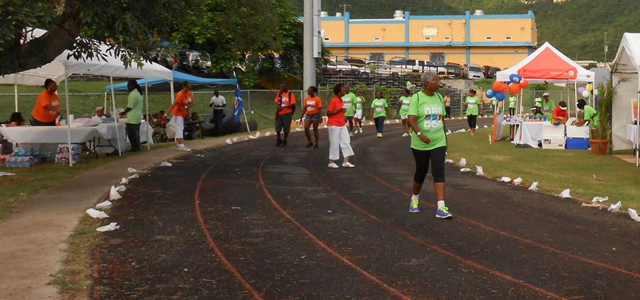 Walkers round the track Sunday in the St. Thomas Relay for Life.