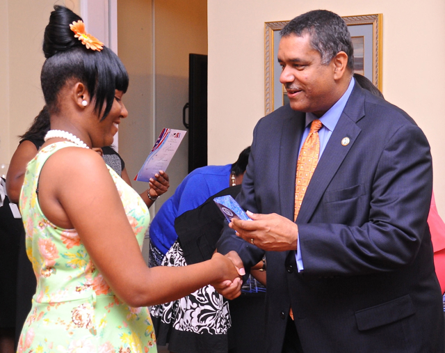 Gov. John deJongh Jr. congratulates JAGVI graduate Alicia George. (Government House photo)