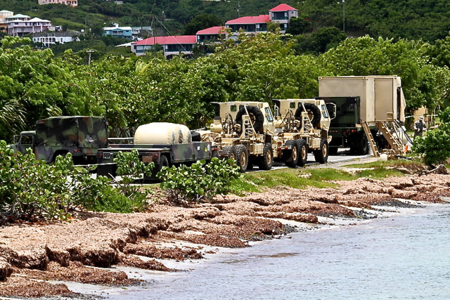 VING soldiers set up a portable water purification plant at Altoona Lagoon.