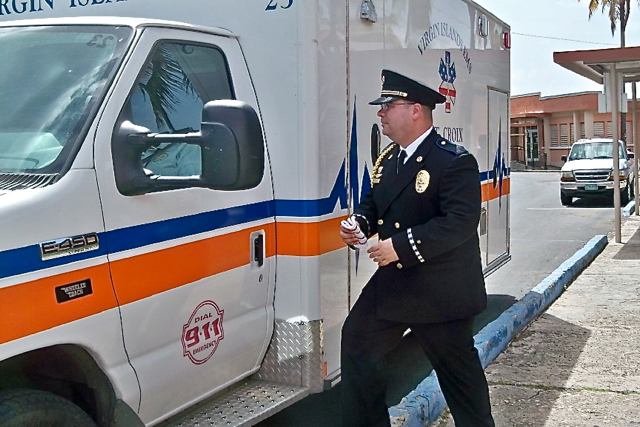 Paramedic Nowel Garcia returns to the ambulance after the ceremony.