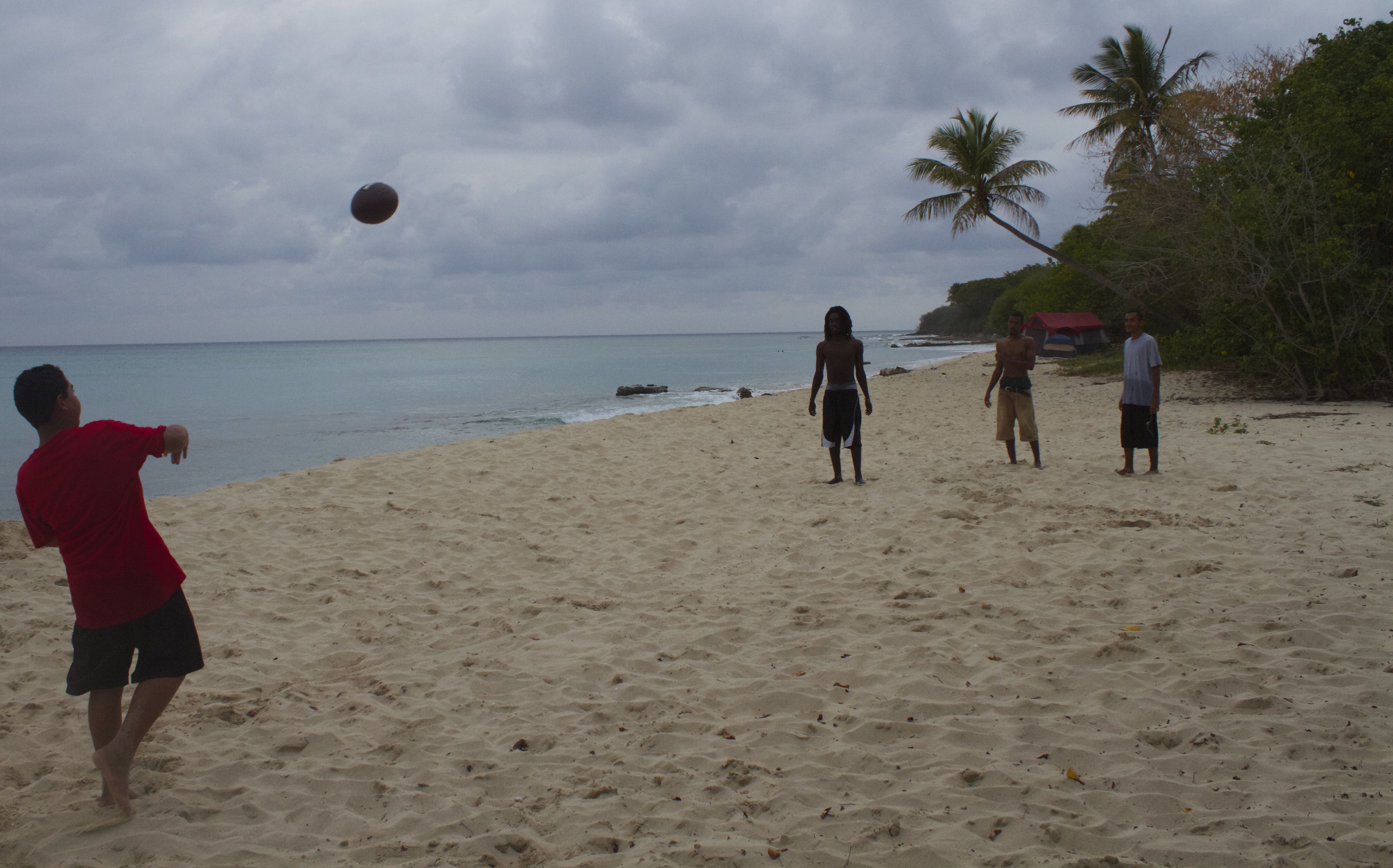 A pickup game of football on Sprat Hall Beach.