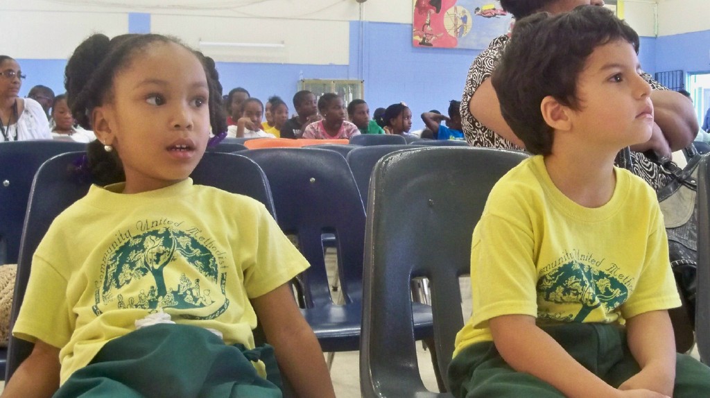 Kindergarteners Sarai Gomez and Mohammad Jarazi look engrossed in the music.