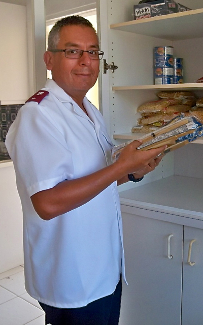 Lt. David Rojas checks the Salvation Army pantry on St. Croix.