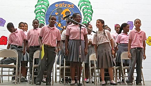 Students in Gladys Abraham Elementary School's EarlyAct Club celebrate their accomplishments during Wednesday's ceremony.