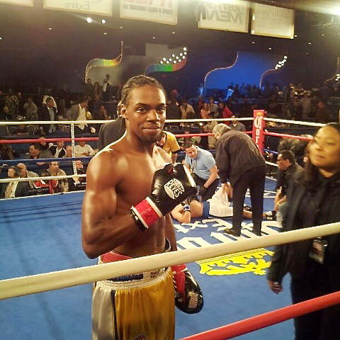 John Jackson smiles for the camera Friday as his opponent is tended to in the ring. (ESPN photo)