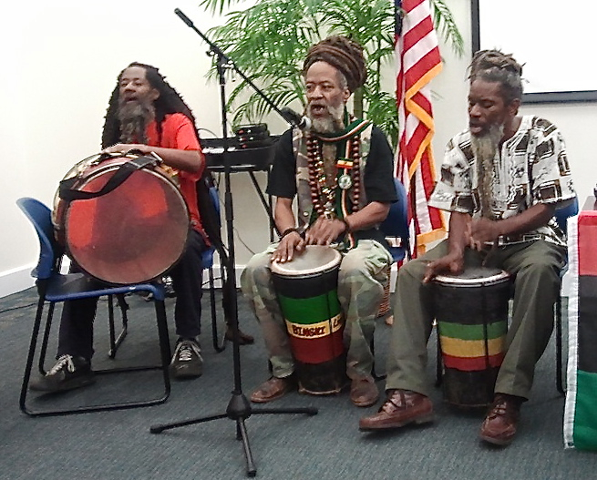 Rastafarian musicians open the African Heritage forum with niyabinghi chants.