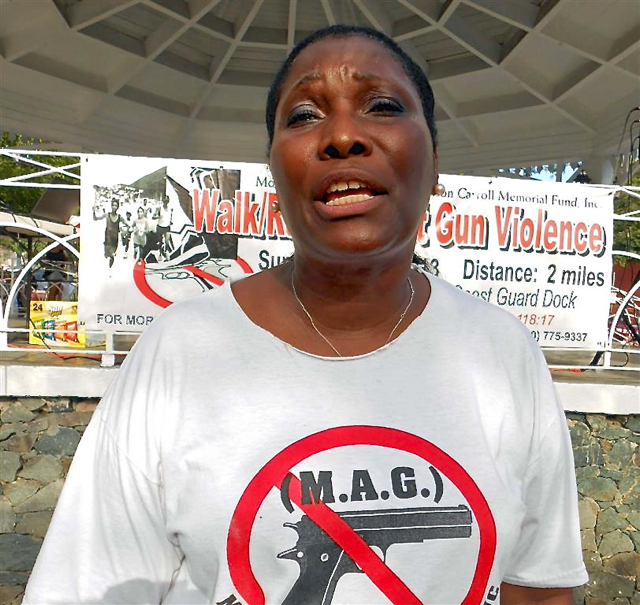 Celia Carroll, president of Mothers Against Guns, pleads for an end to violence.