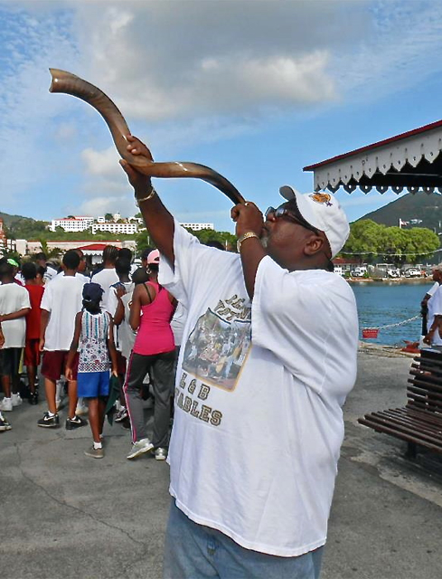 oel Gifft plays a call on the shofar, opening the 10th Annual Walk/Run Against Violence Sunday.