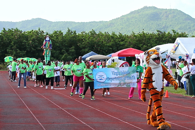 The Country Day School mascot leads the Relay for Life opening parade around the Educational Complex track Saturday.