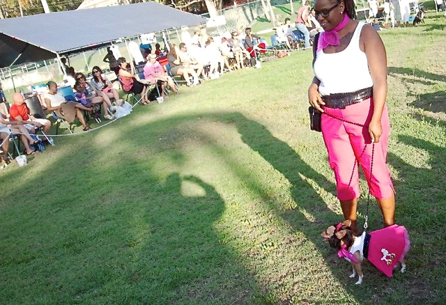  Crystal Allen and Taliah, her six-year-old Chihuahua, have the crowd's attention in their matching outfits.