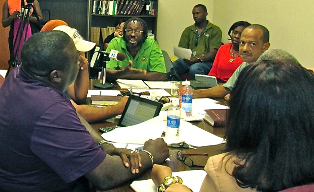 Adelbert Bryan, at the head of the conference table, chairs Tuesday's St. Croix Board of Elections meeting.