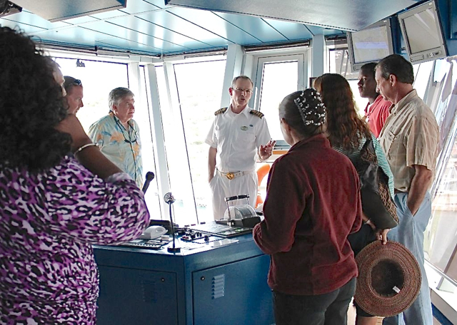 Emerald Princess captain Nicholas Nash, center, treat the awardees to a rare tour of the bridge.