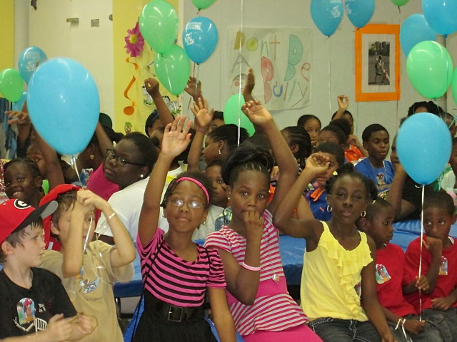 Hands fly up when Gov. John deJongh asks who read more than five books.