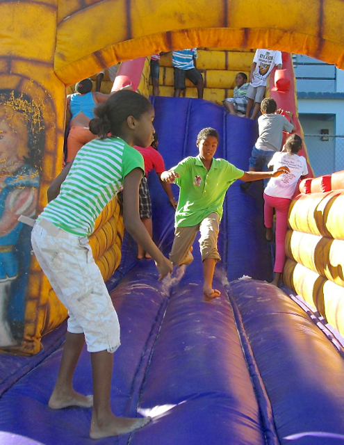 The Bouncy House slide was popular at Saturday's reading party.