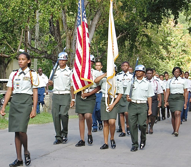 The Eudora Kean High School Jr. ROTC parades the colors in St. John during Veterans Day observances.