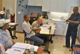 Tony Bhola (right) teaches CELL processor technology class.