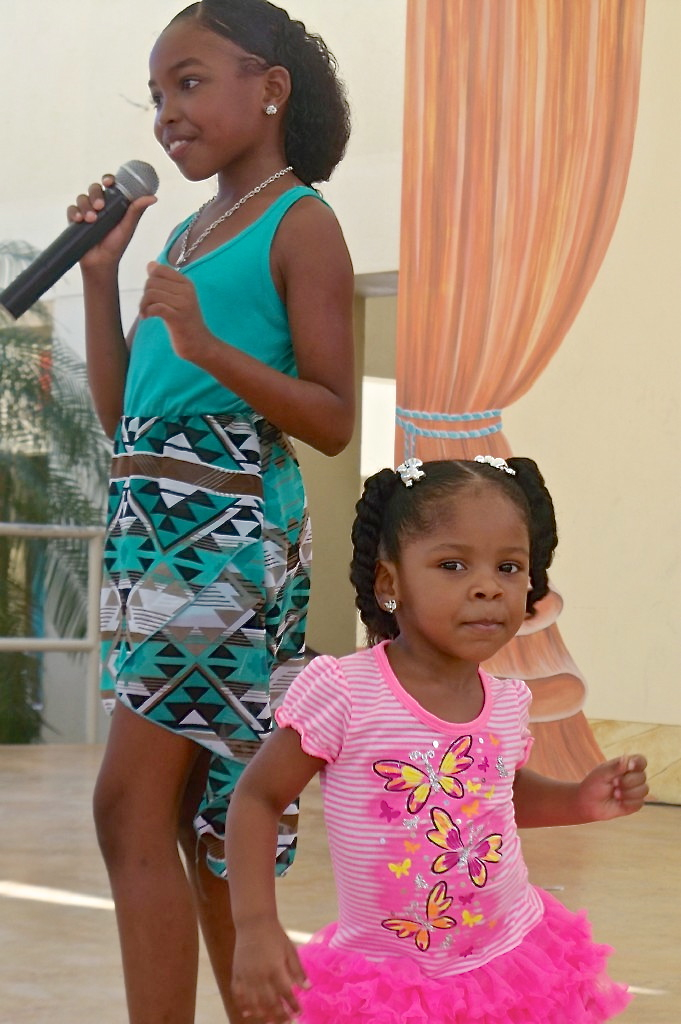 Erica Chery, 9, and Railah Lockhart, 2, dance and sing at the eSIP Expo.