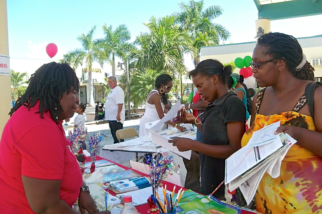 Esther Gordon-David, left, talks about GED testing with Sherrine Cupid and Charleen Creighton.