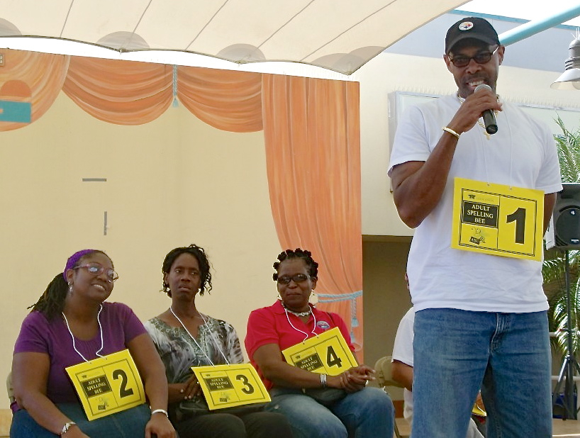 Adult spelling bee contestants, from left, Merva Sage, Hazel Boissiere, Patricia Matthew and Yves Abraham.