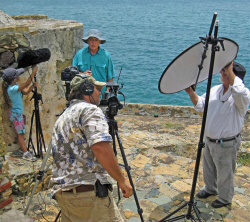 Filming the documentary are Erik Miles, center on camera, daughter Portia on left with microphone, Charles Consolvo, and Erik's father Ray Miles on right.