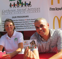 Susan Kraeger (left) and Miguel Padilla showing a corporate Big Mac voucher for McHappy Day.