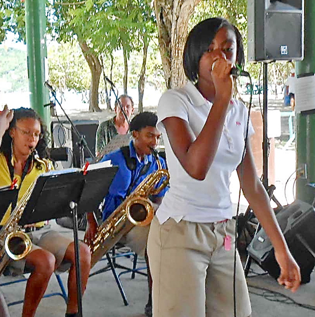 Kandysee Leonard sings an old standard, the IEK Jazz Band.