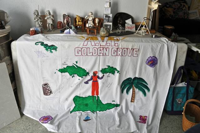 A banner created by inmates at the Golden Grove Adult Correctional Facility as part of the Alternatives to Violence Project, decorates the table at the new Community Peace Center in Frederiksted.