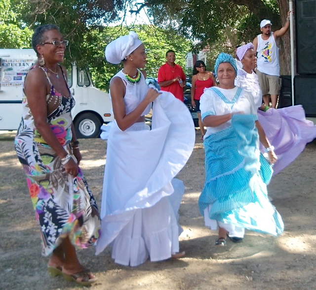 Donna Christensen, left, dances the bomba with other women at the VI-PR Friendship celebration.